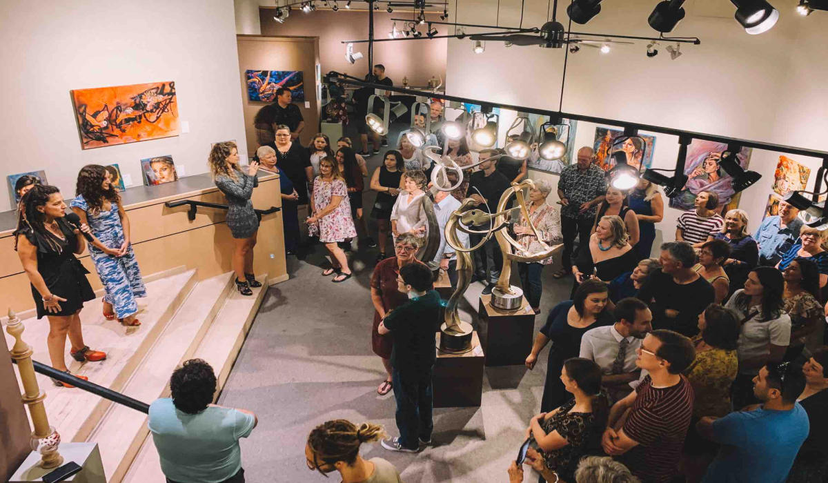 people in a open gallery at opening